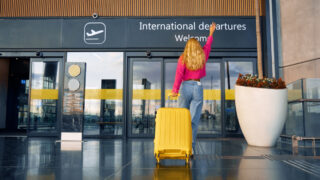 Female traveler entering international terminal