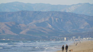 People walking on Hollywood Beach in Oxnard, CA