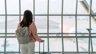 woman with luggage at airport