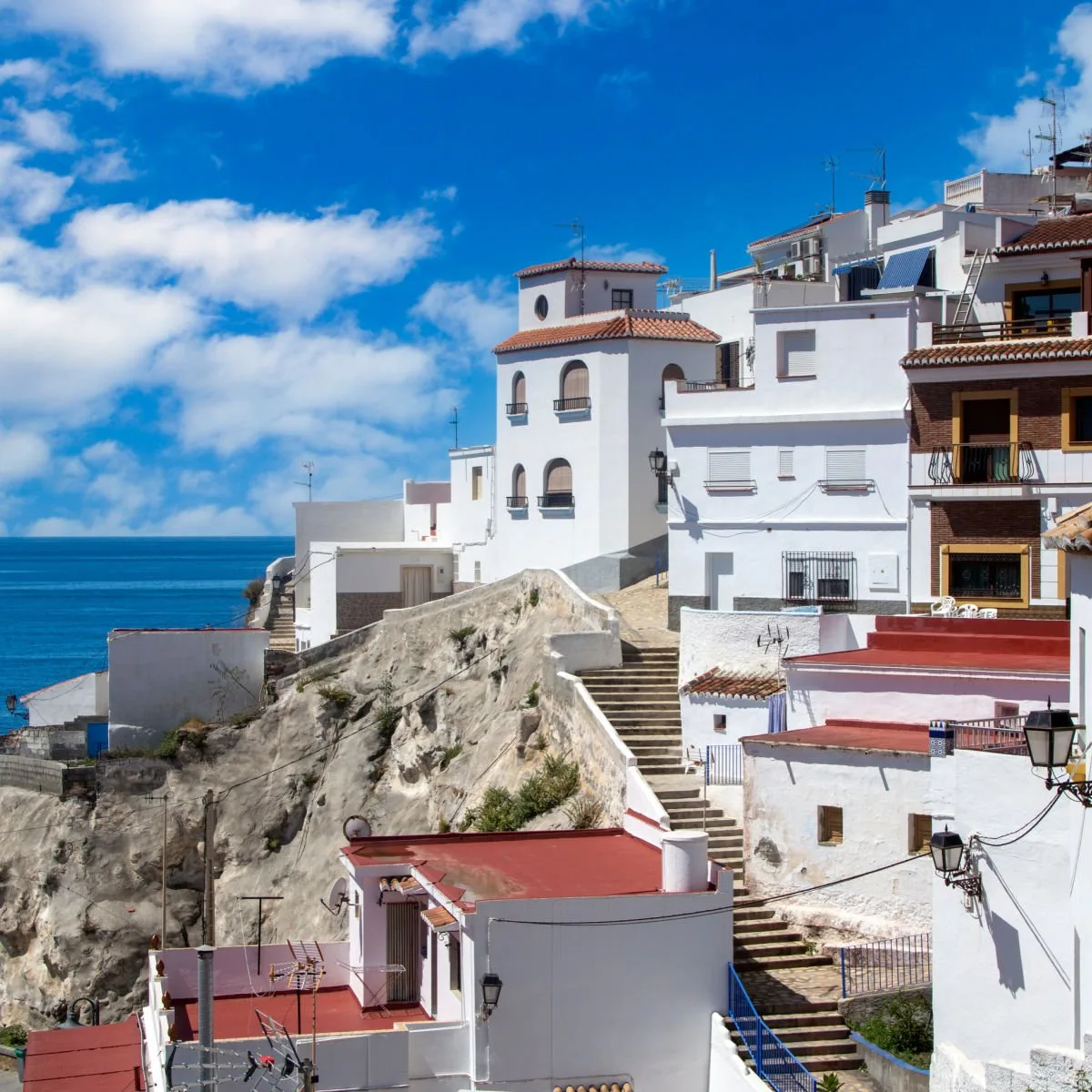 Cliffside villas and cobbled alleyways in Salobreña, Spain