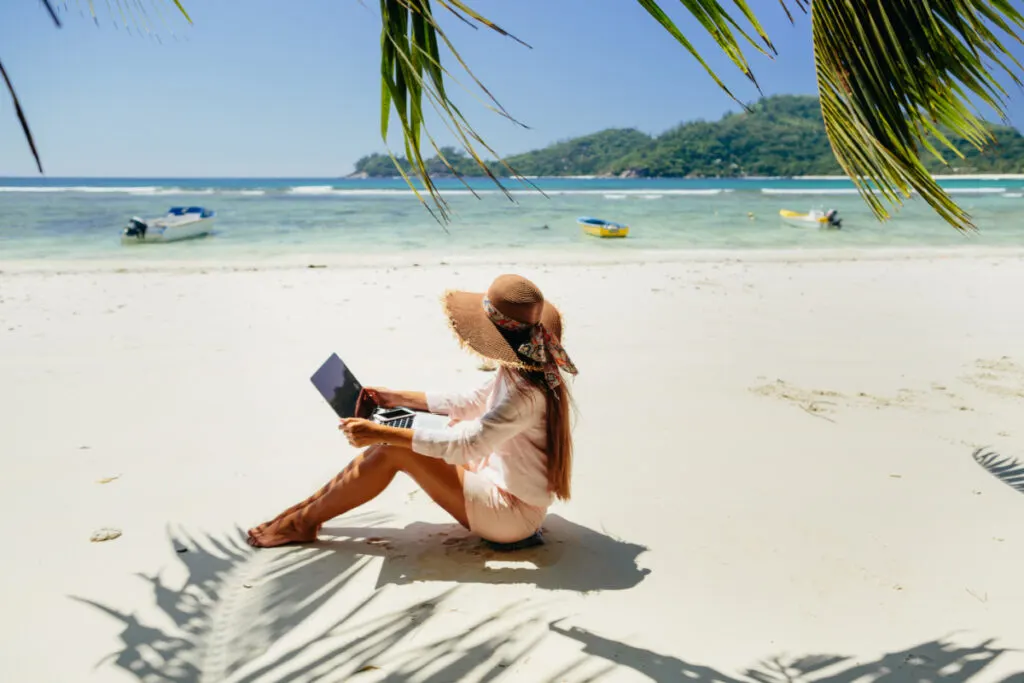 Woman Working on the Beach