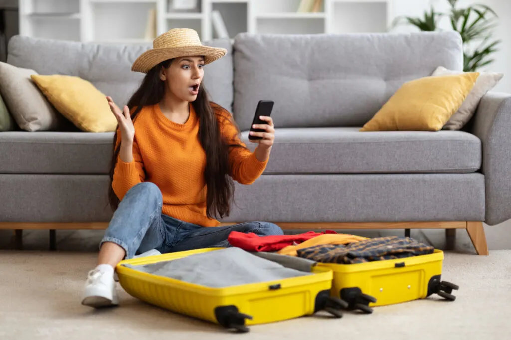 Surprised Traveler Packing Suitcase