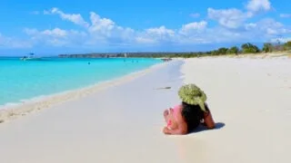 Woman relaxing in Bahia de las Aguilas near Cabo Rojo, Dominican Republic